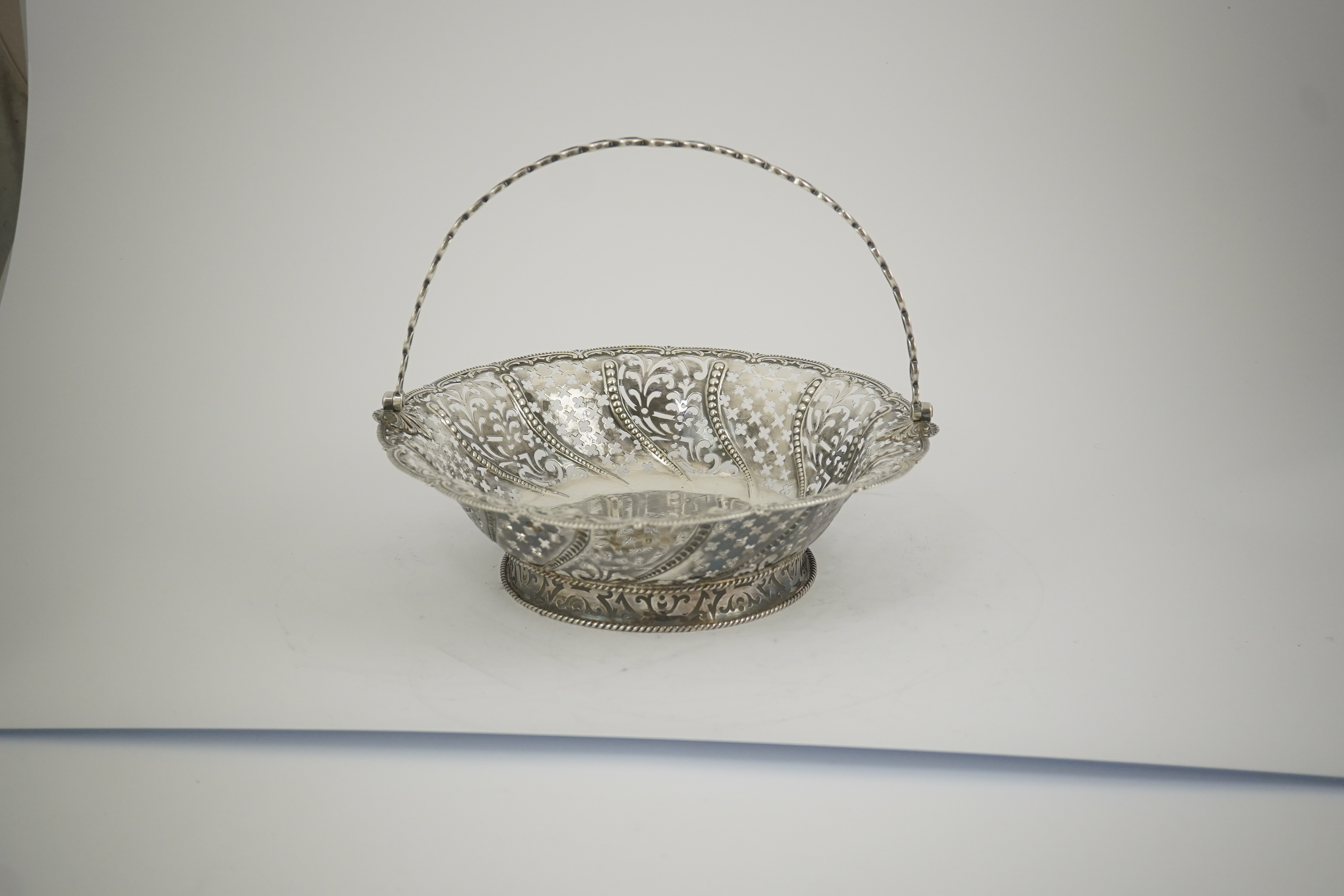 A late George II pierced silver cake basket, by William Plummer?